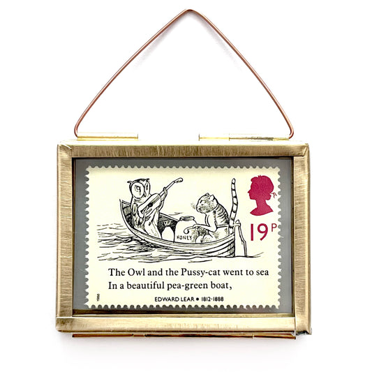 The Owl and the Pussy Cat genuine 19p British postage stamp in a real brass frame that measures 5cm x 4cm. The poem is by Edward Lear, and includes an illustration and the first line of the poem on the stamp. It was issued in 1988 by Royal Mail.
